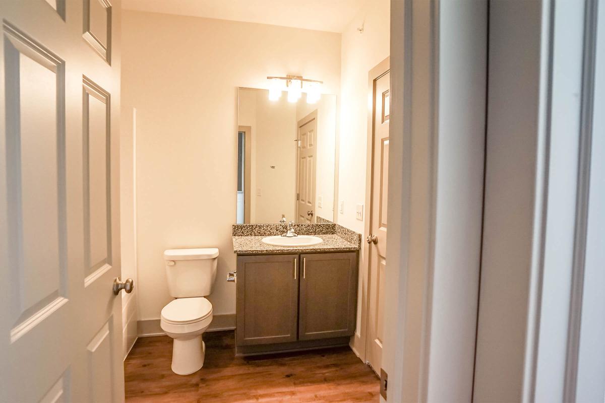 a white sink sitting next to a door