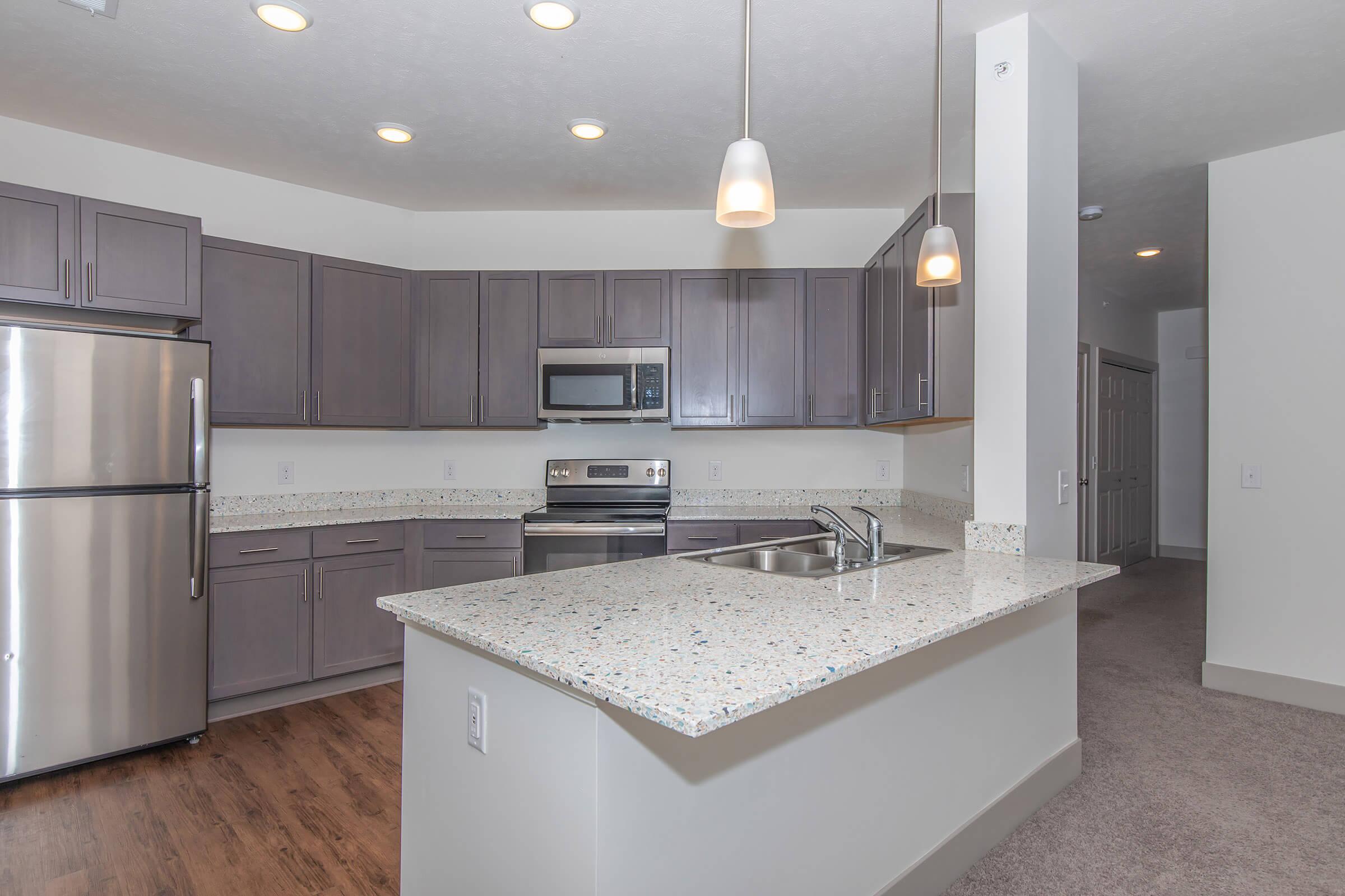 a modern kitchen with stainless steel appliances