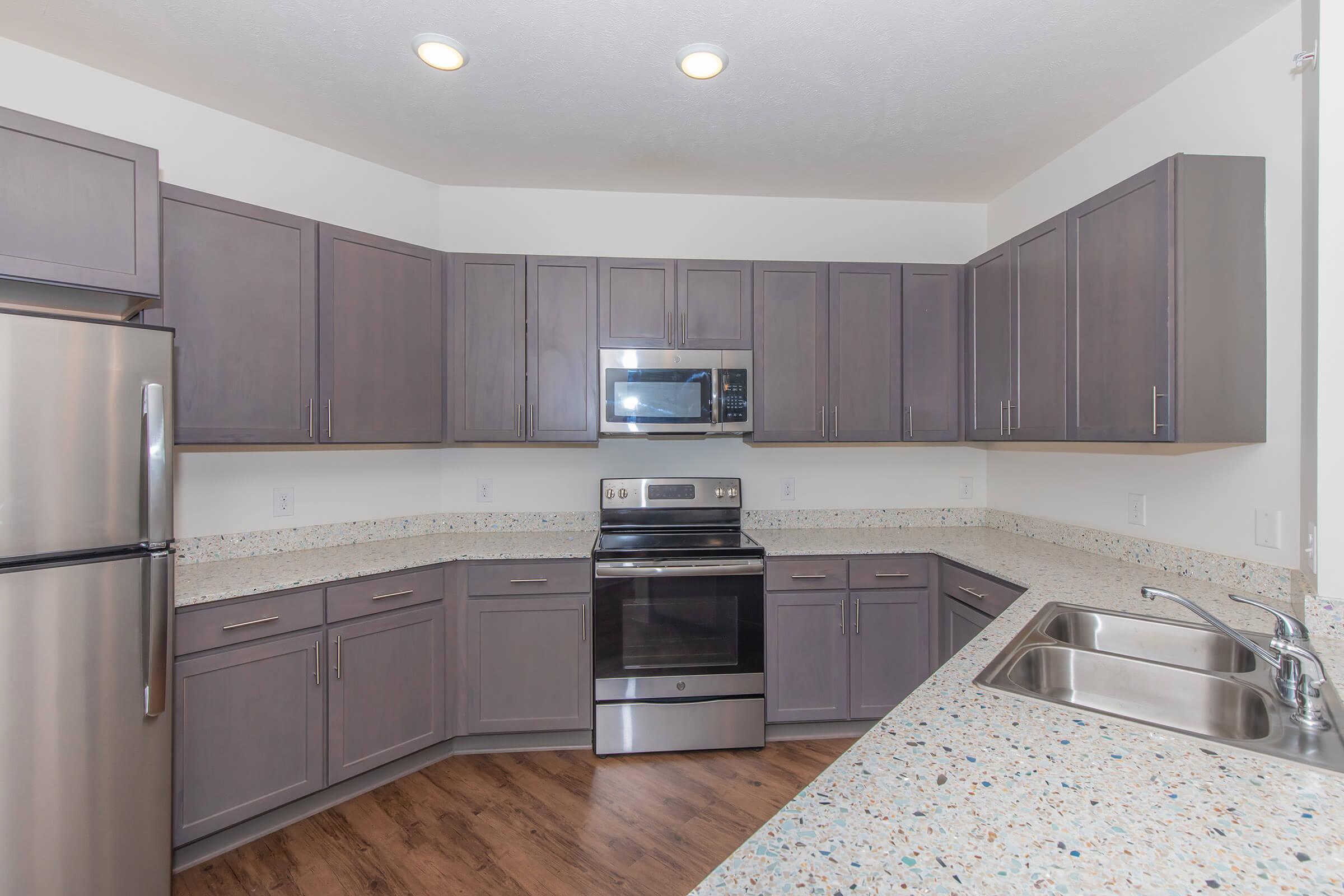 a large kitchen with stainless steel appliances