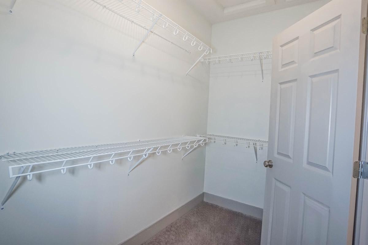 a room with a sink and a mirror