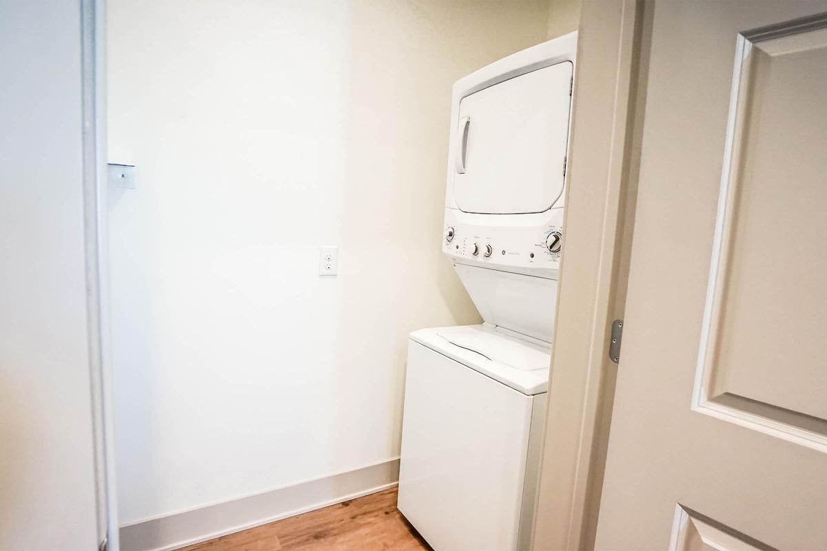 a white refrigerator freezer sitting next to a door
