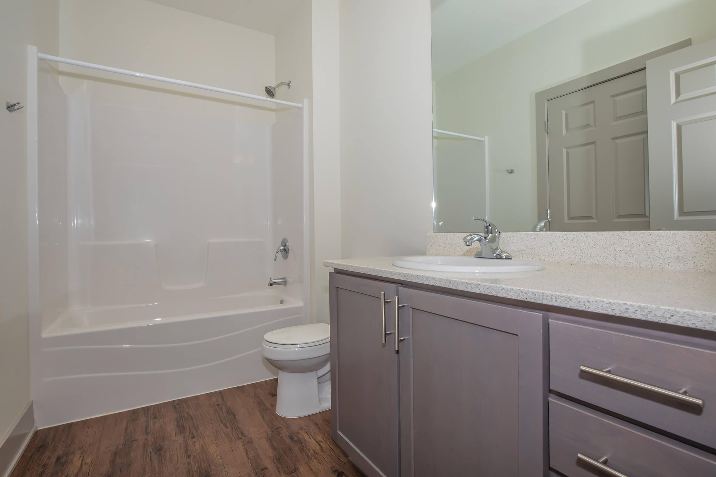 a room with a sink and a shower