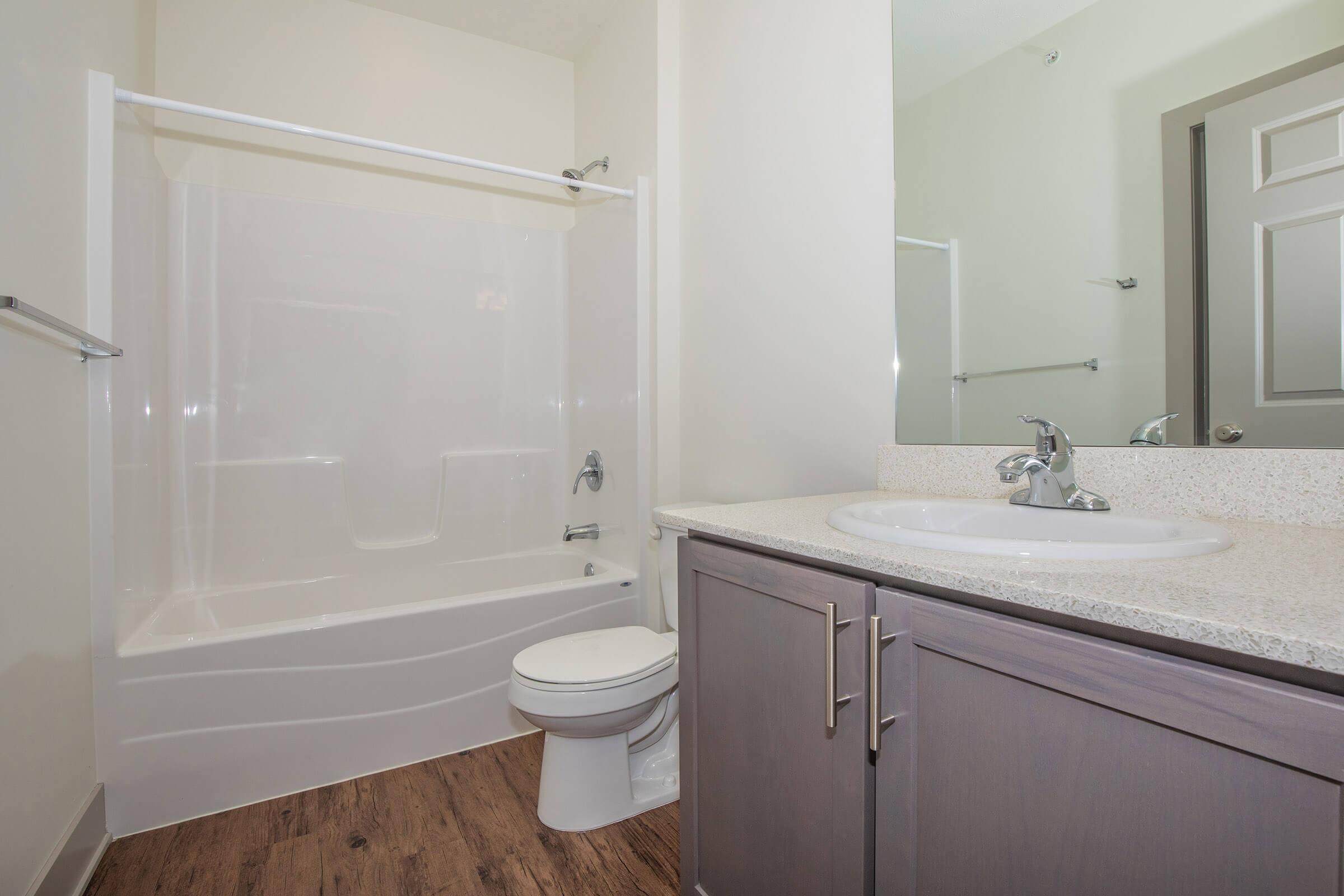 a room with a sink and a shower