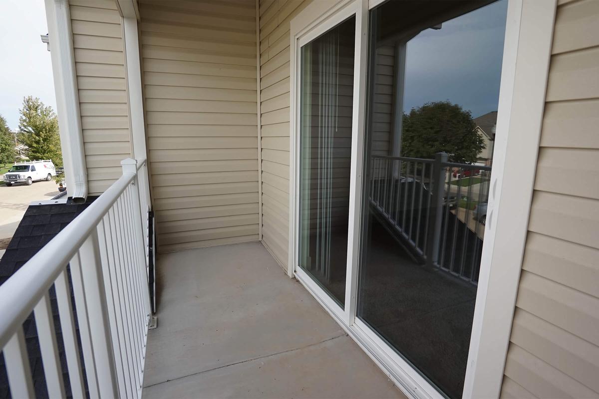 a house with a fence in front of a window
