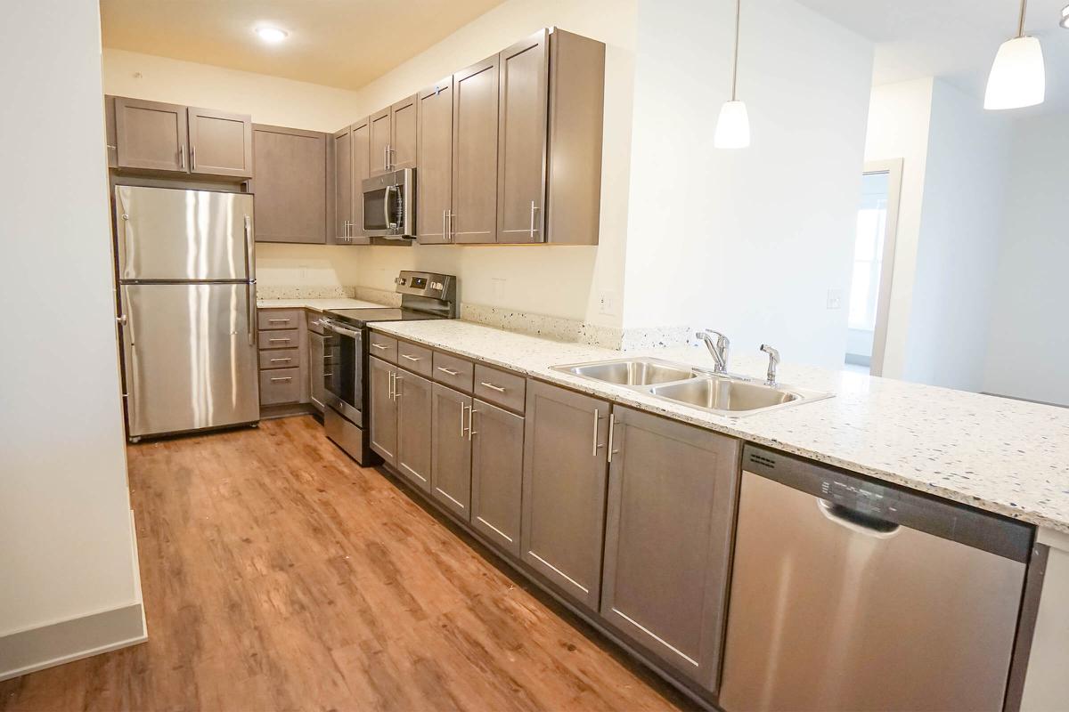 a large kitchen with stainless steel appliances