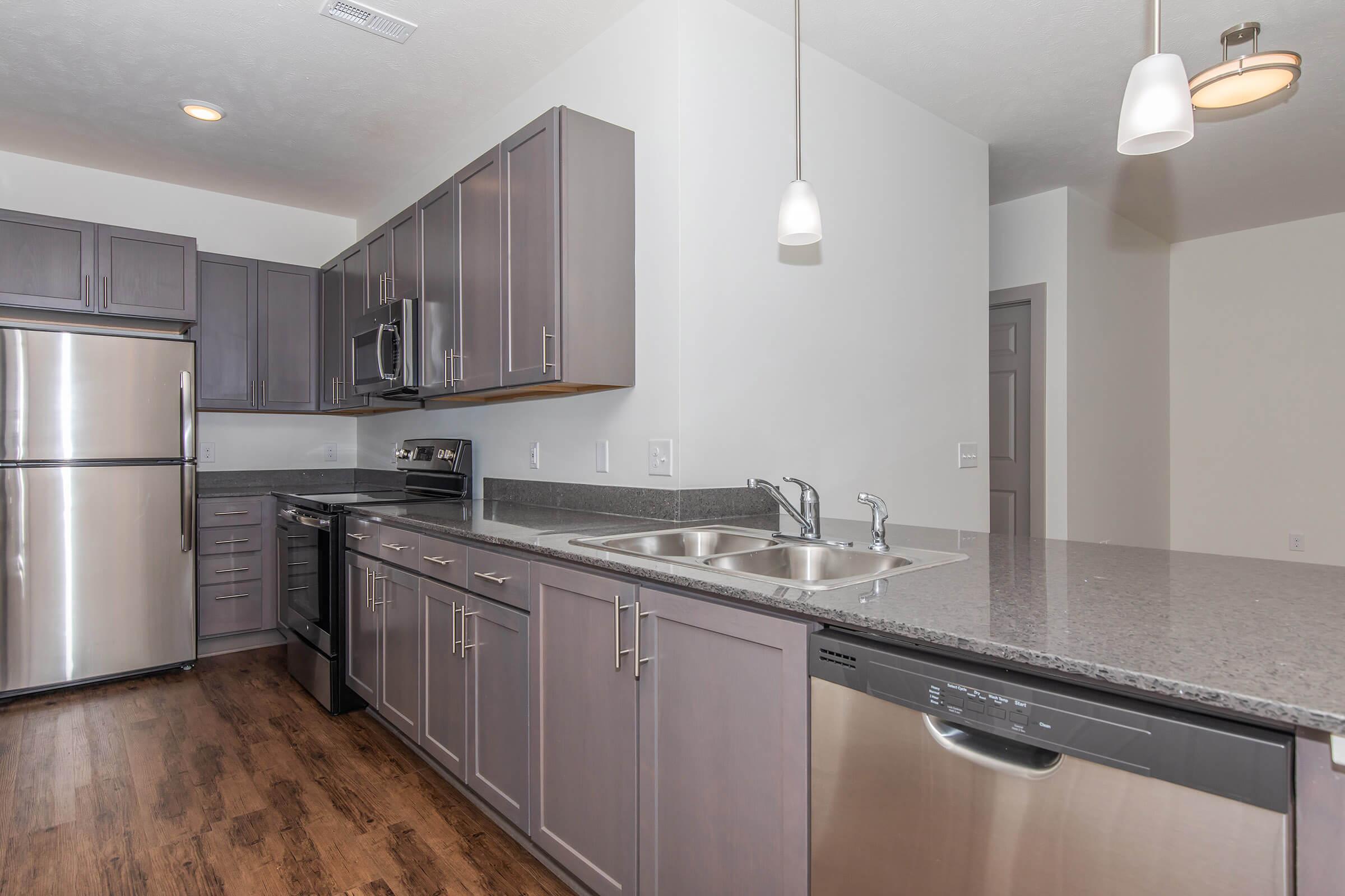 a large kitchen with stainless steel appliances