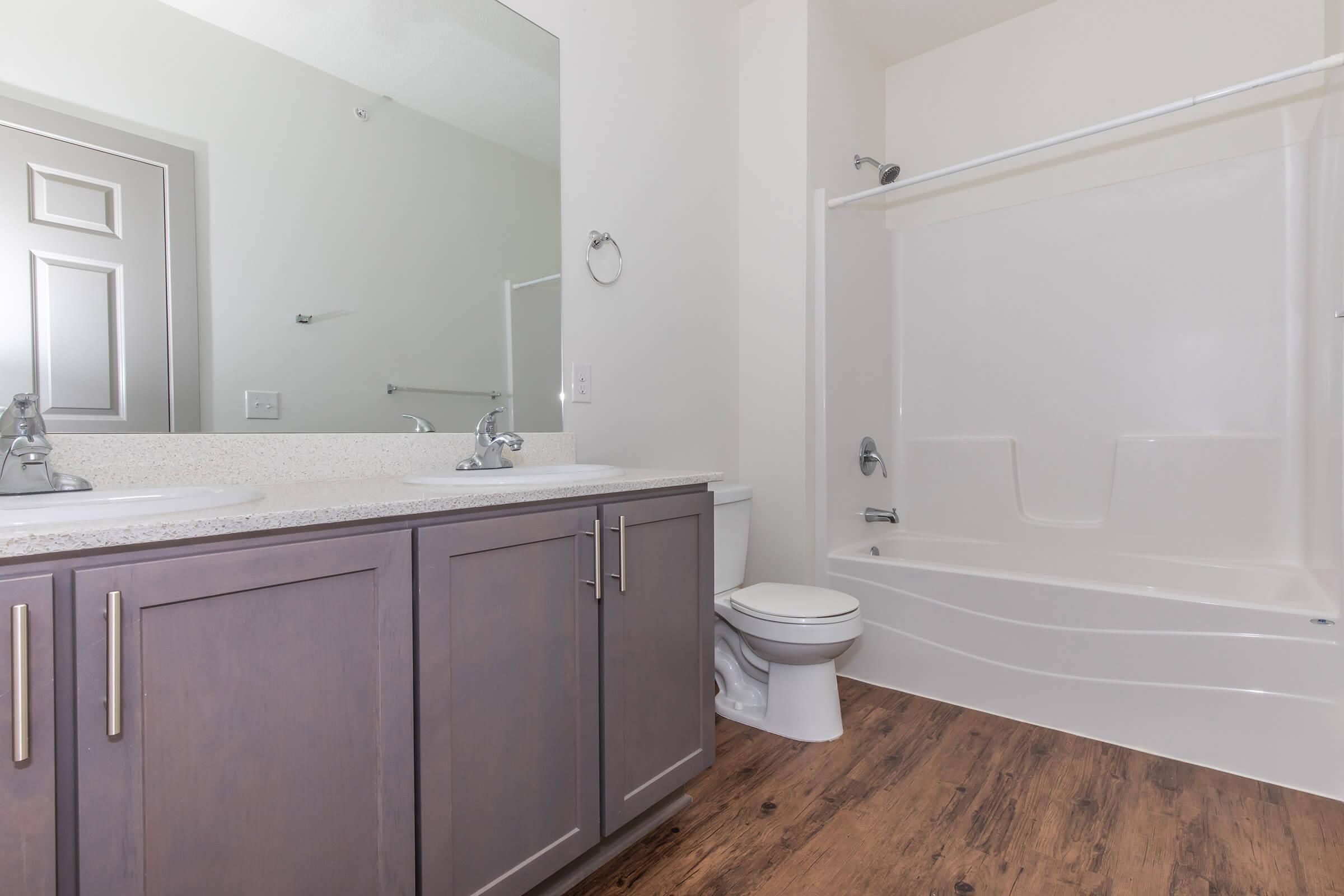 a room with a sink and a shower