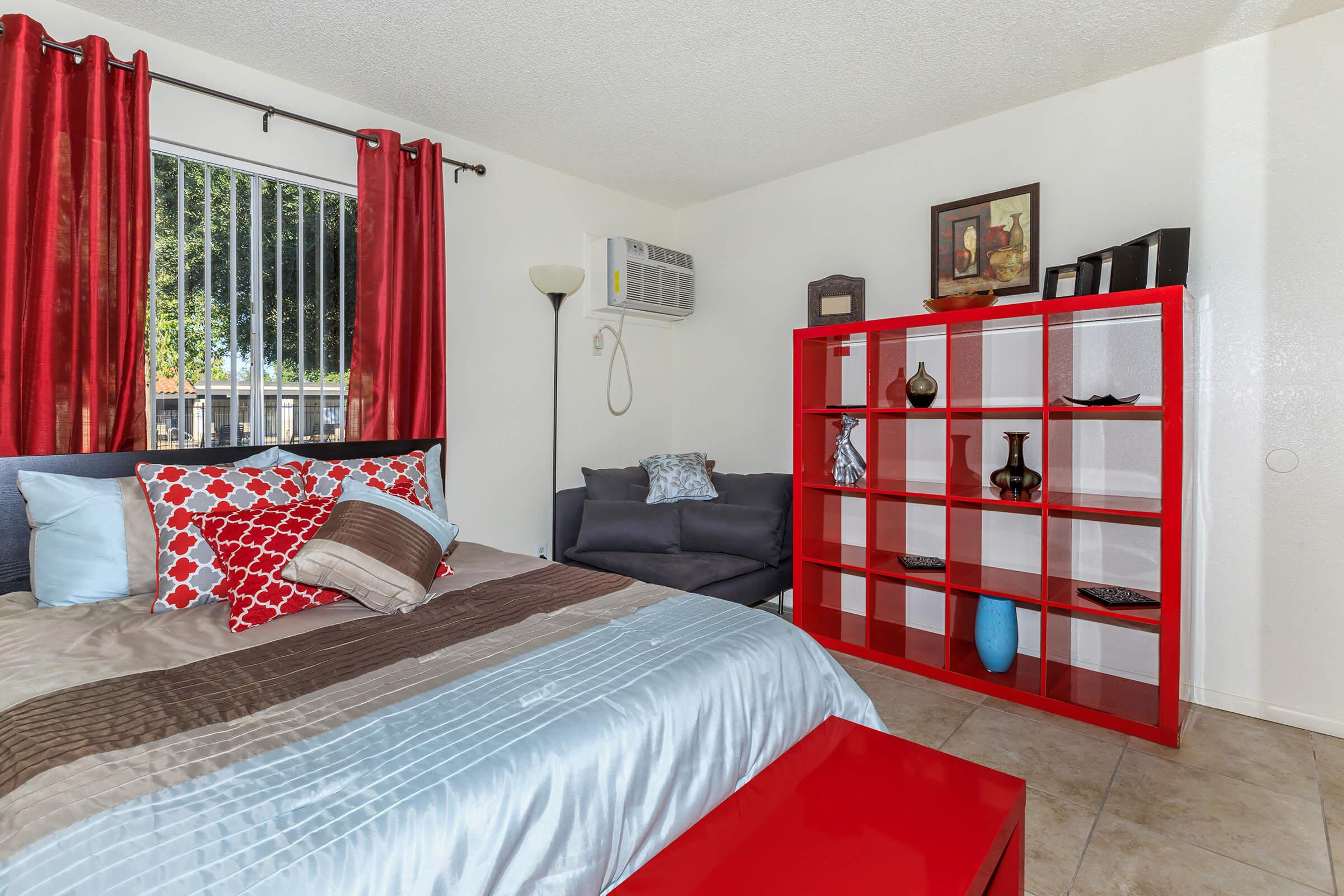 a red and white bed in a room