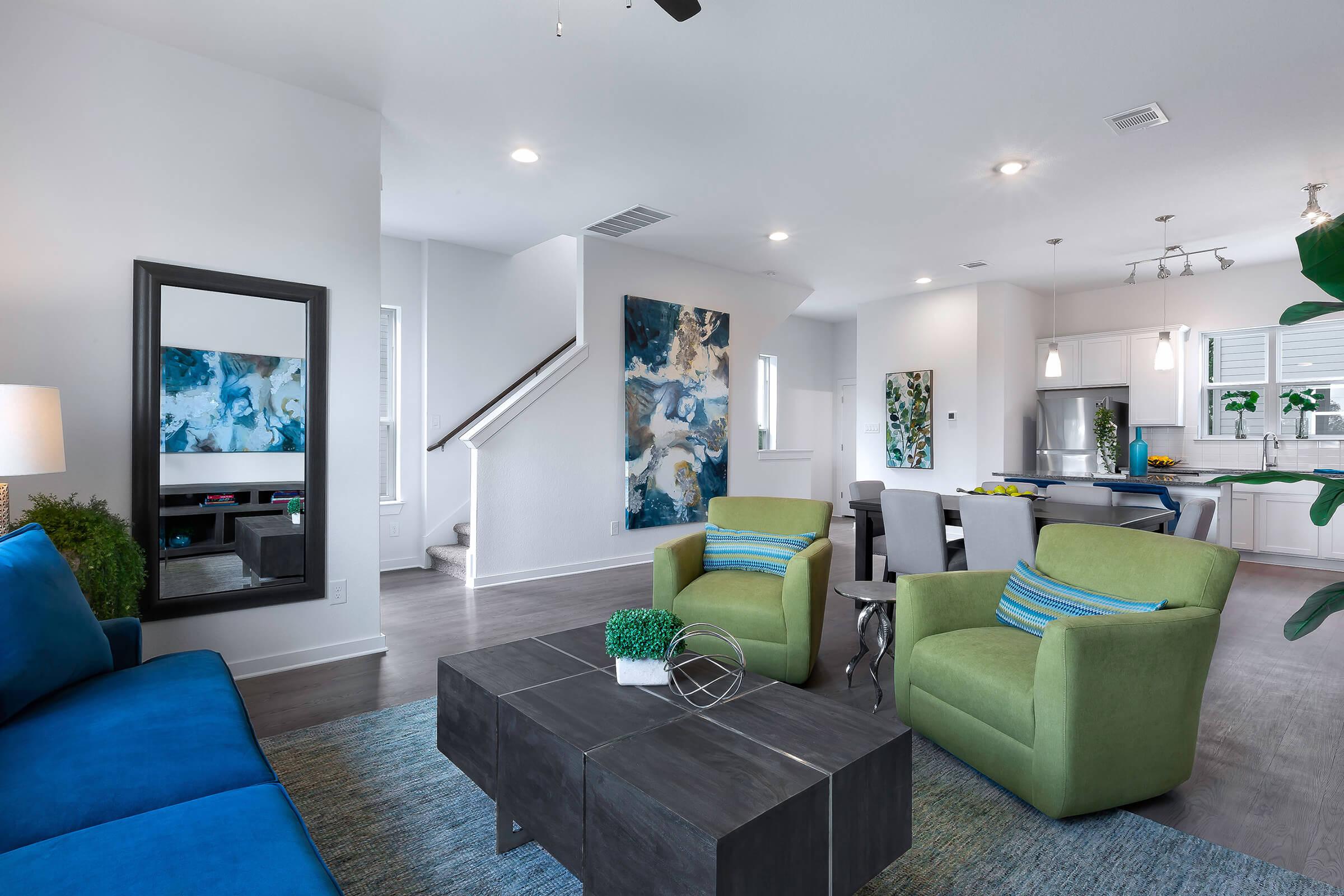 a living room filled with furniture and a tv