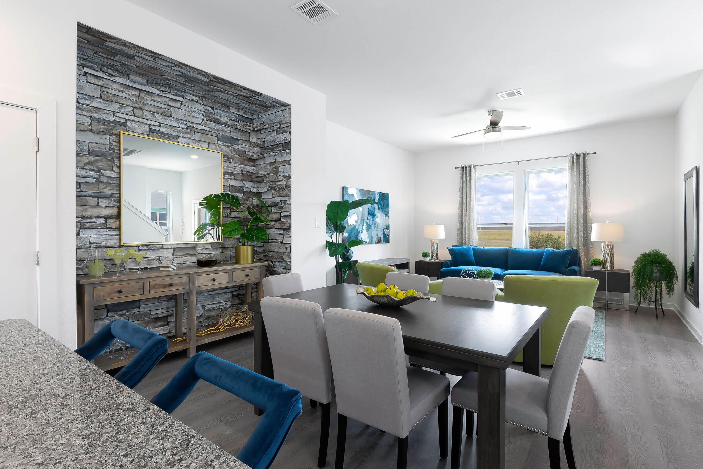 a living room filled with furniture and a large window