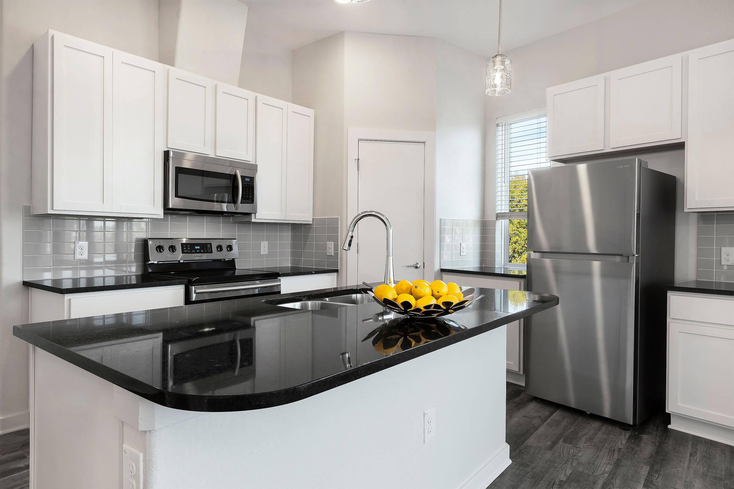 a modern kitchen with stainless steel appliances