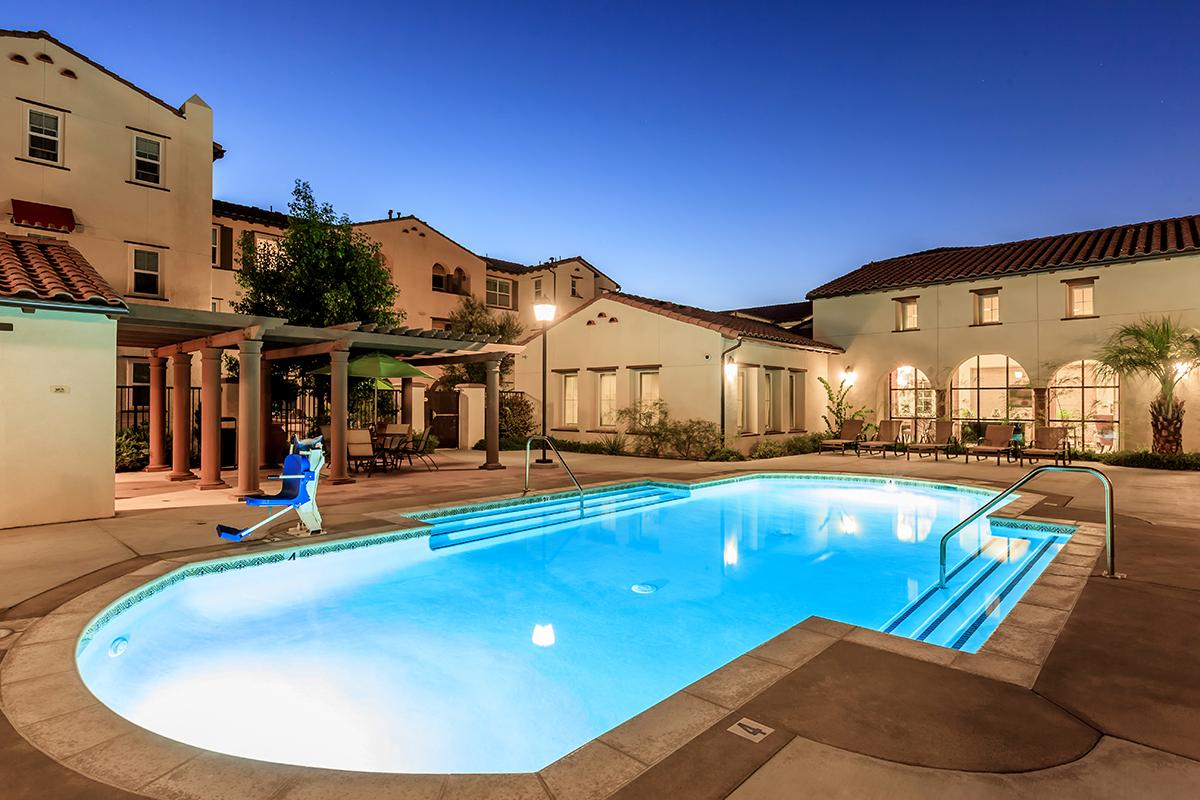 The Paseos at Magnolia Luxury Apartment Homes community pool at night