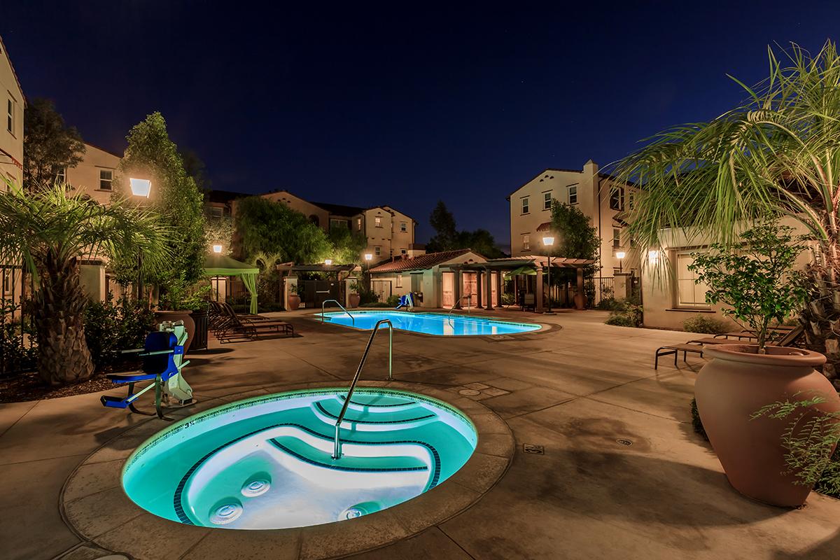 The community spa and the community pool at night