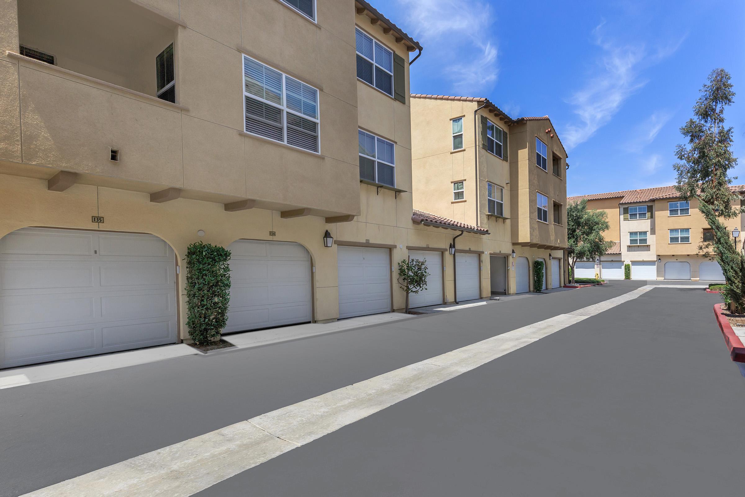 The Paseos at Magnolia Luxury Apartment Homes community building with attached garages