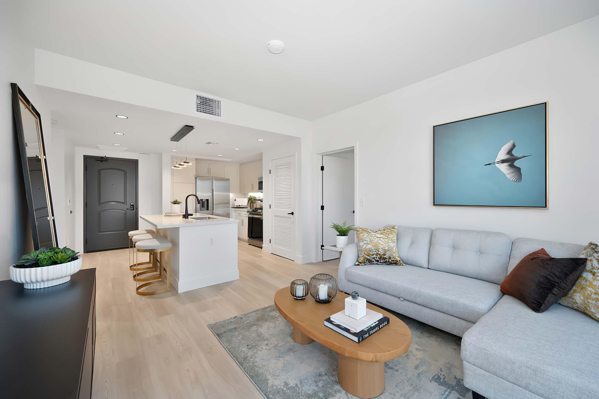 a living room filled with furniture and a flat screen tv