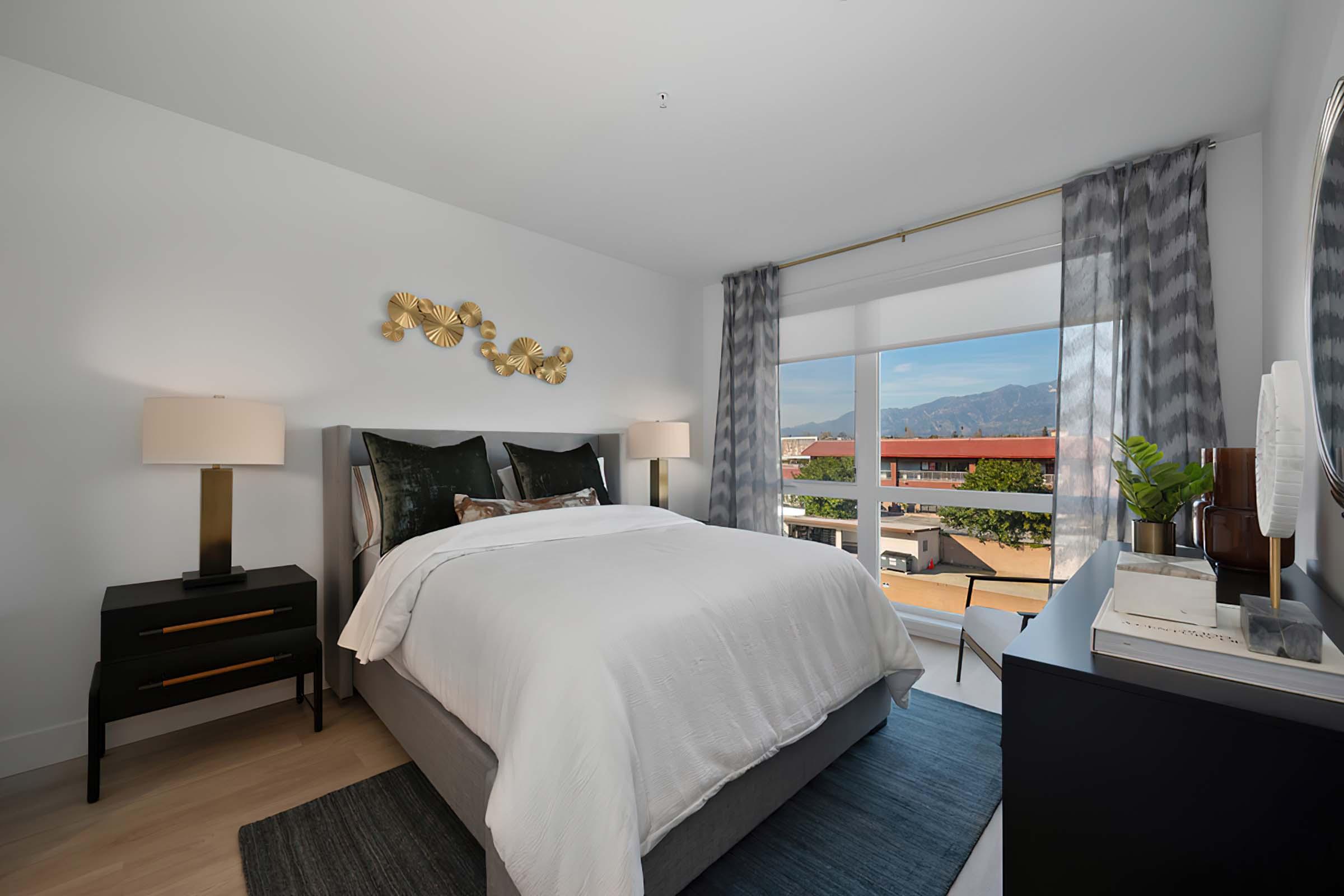 a bedroom with a large bed in a hotel room