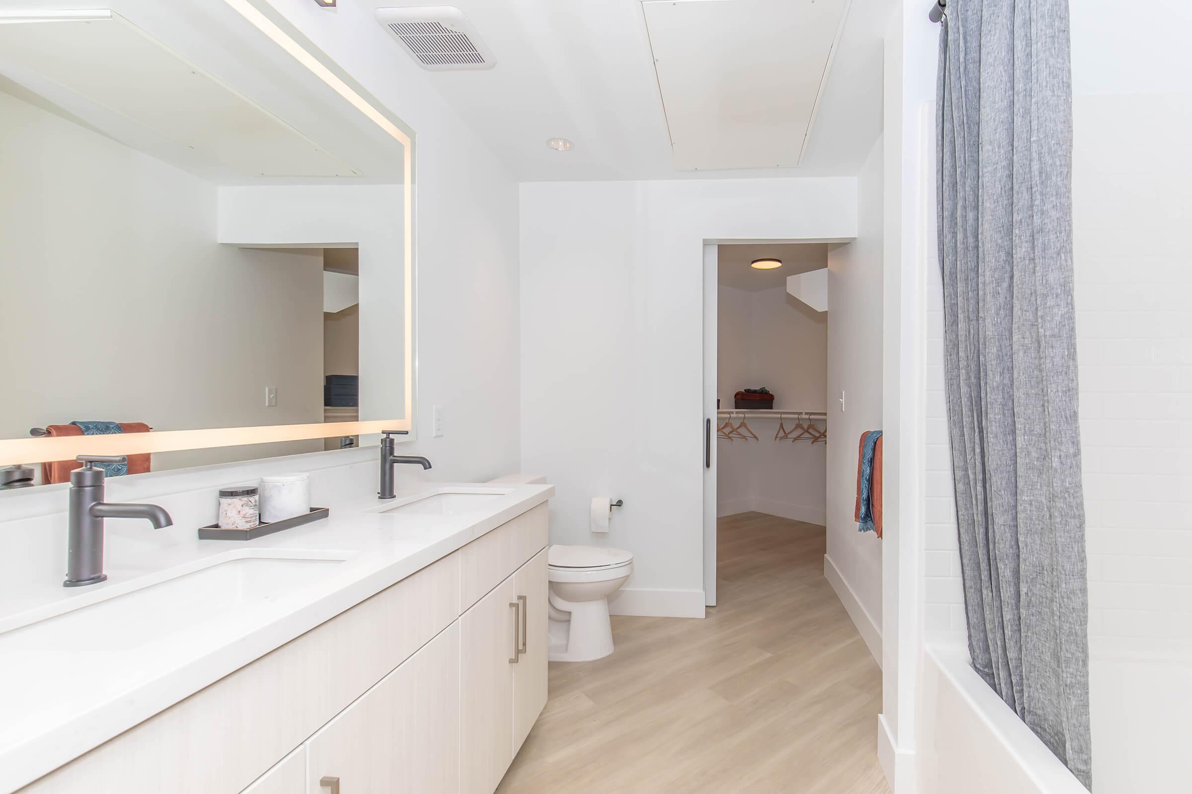 a kitchen with a sink and a mirror