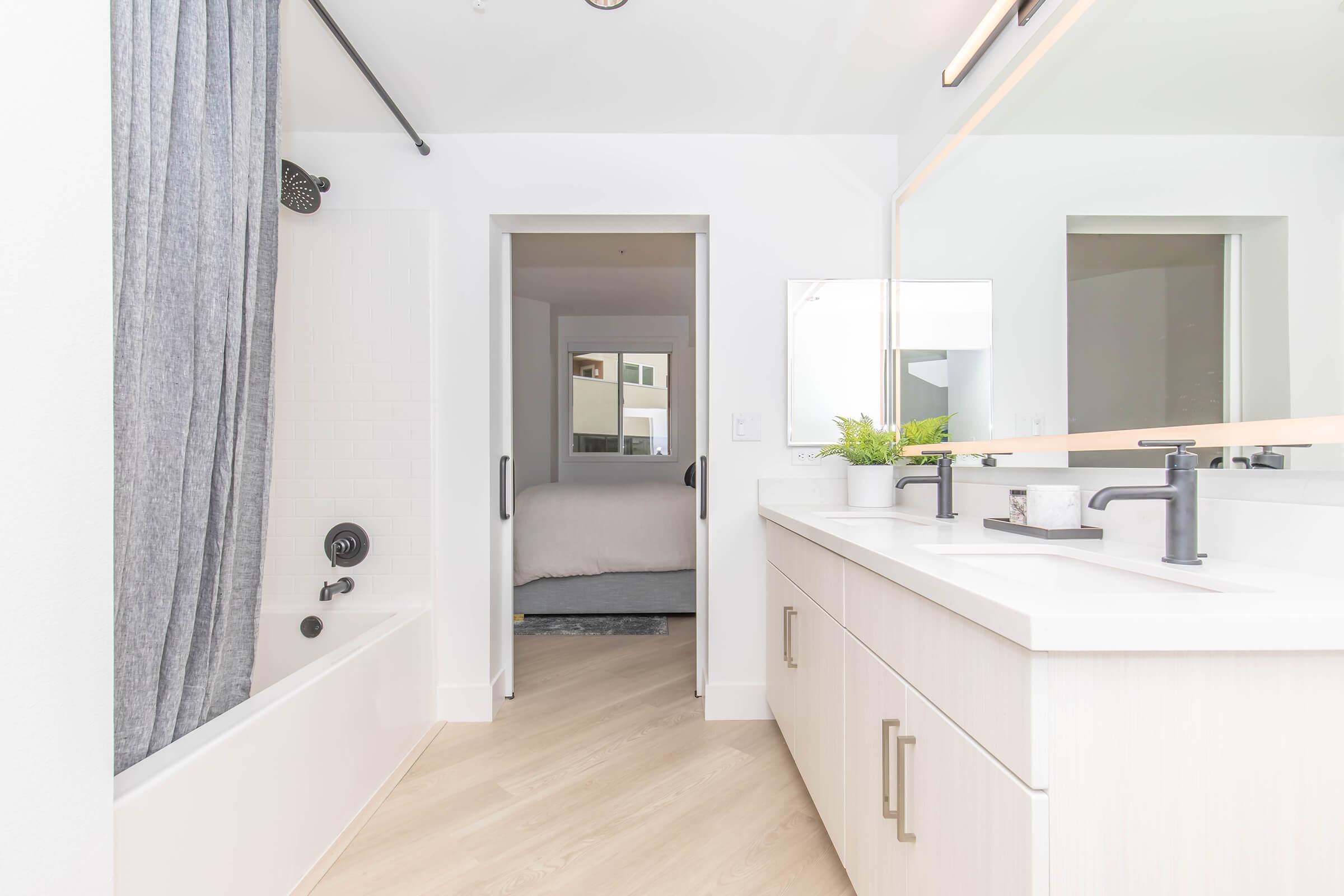 a kitchen with a sink and a mirror