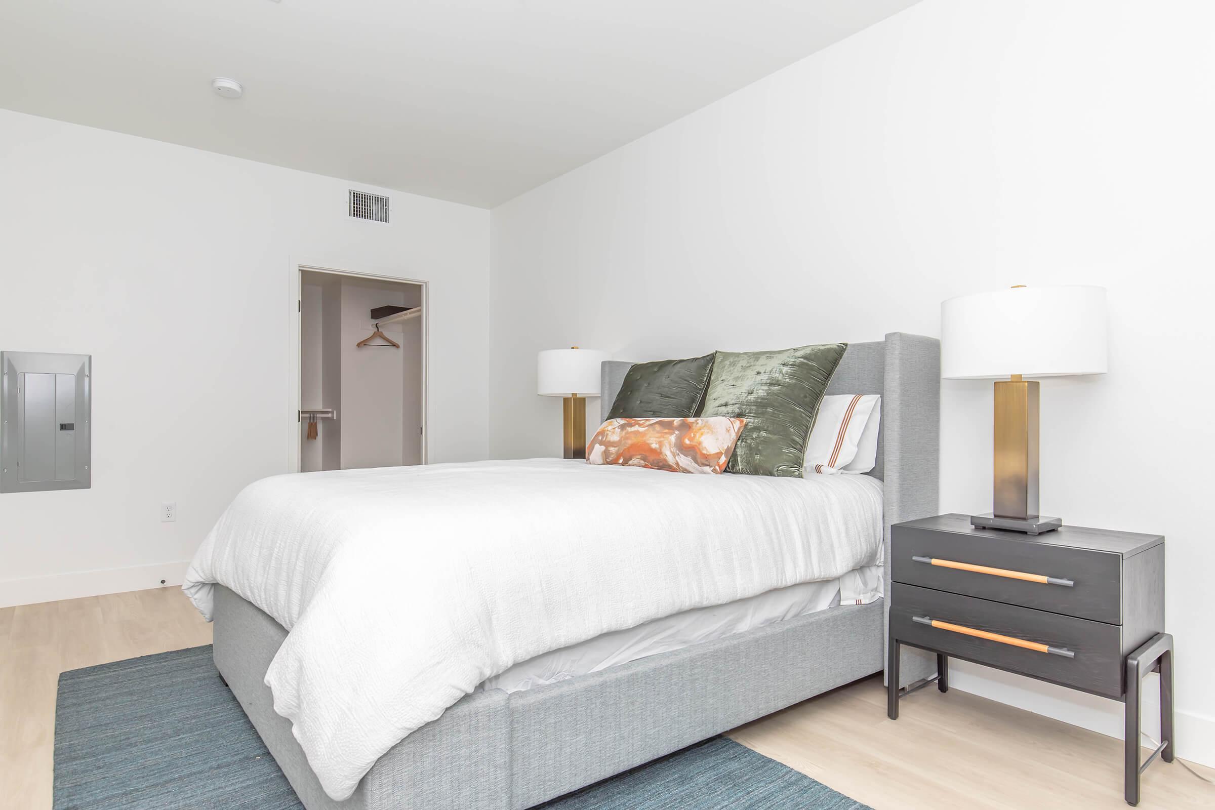 a bedroom with a large bed in a hotel room