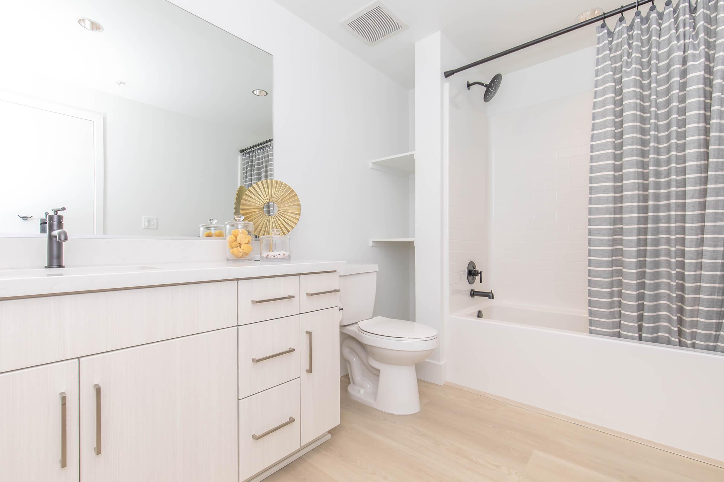 a kitchen with a sink and a shower