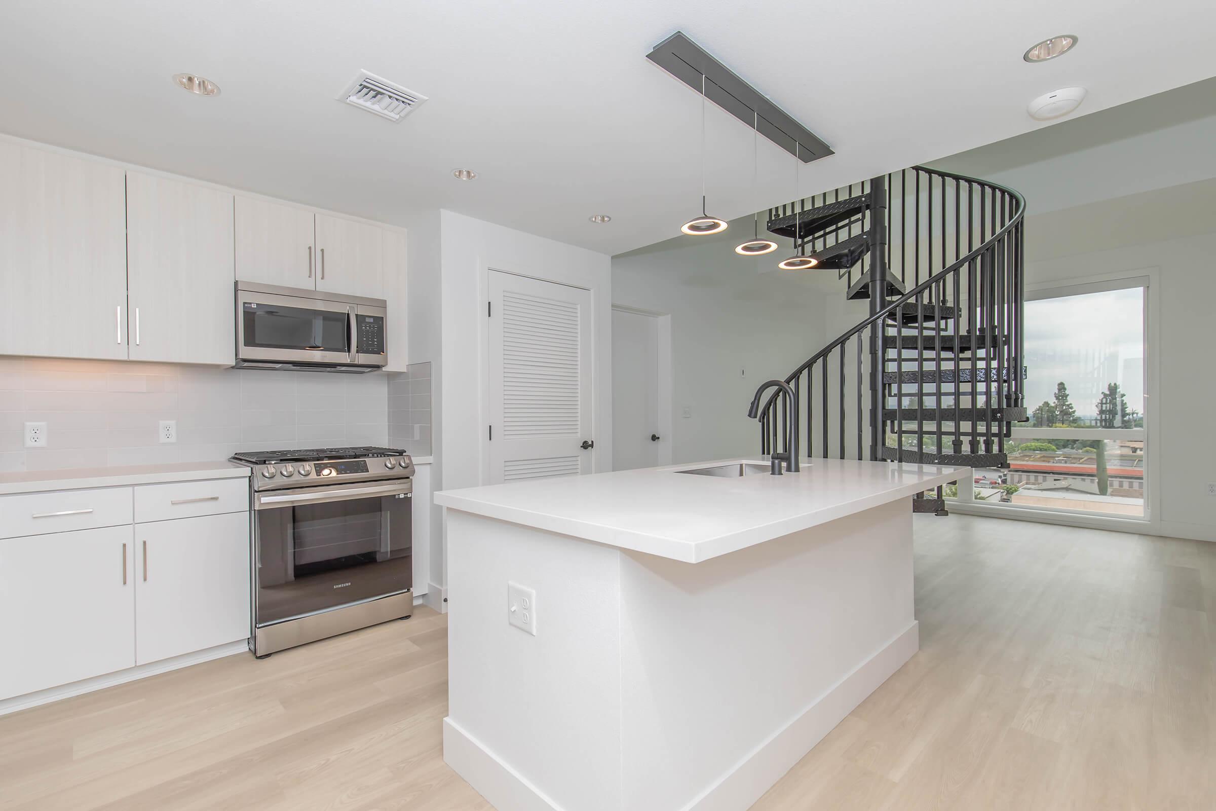 a kitchen with a wooden floor