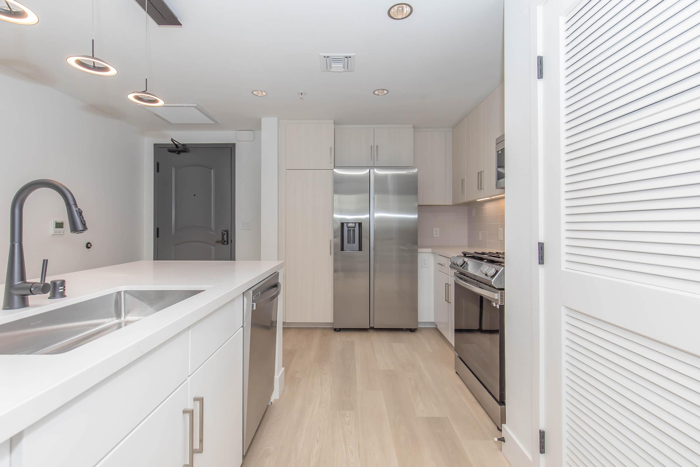 a kitchen with a sink and a window