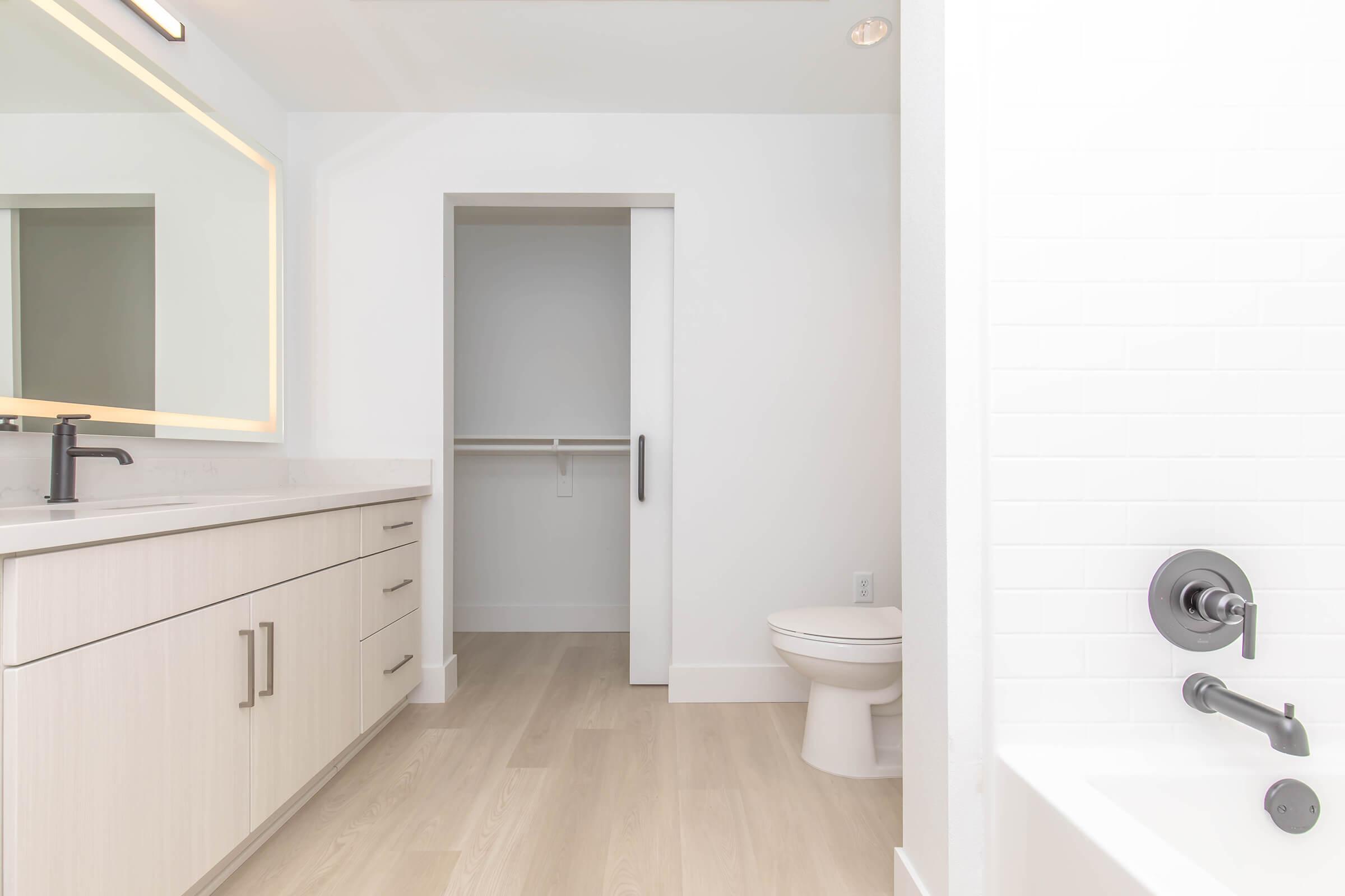 a kitchen with a sink and a mirror