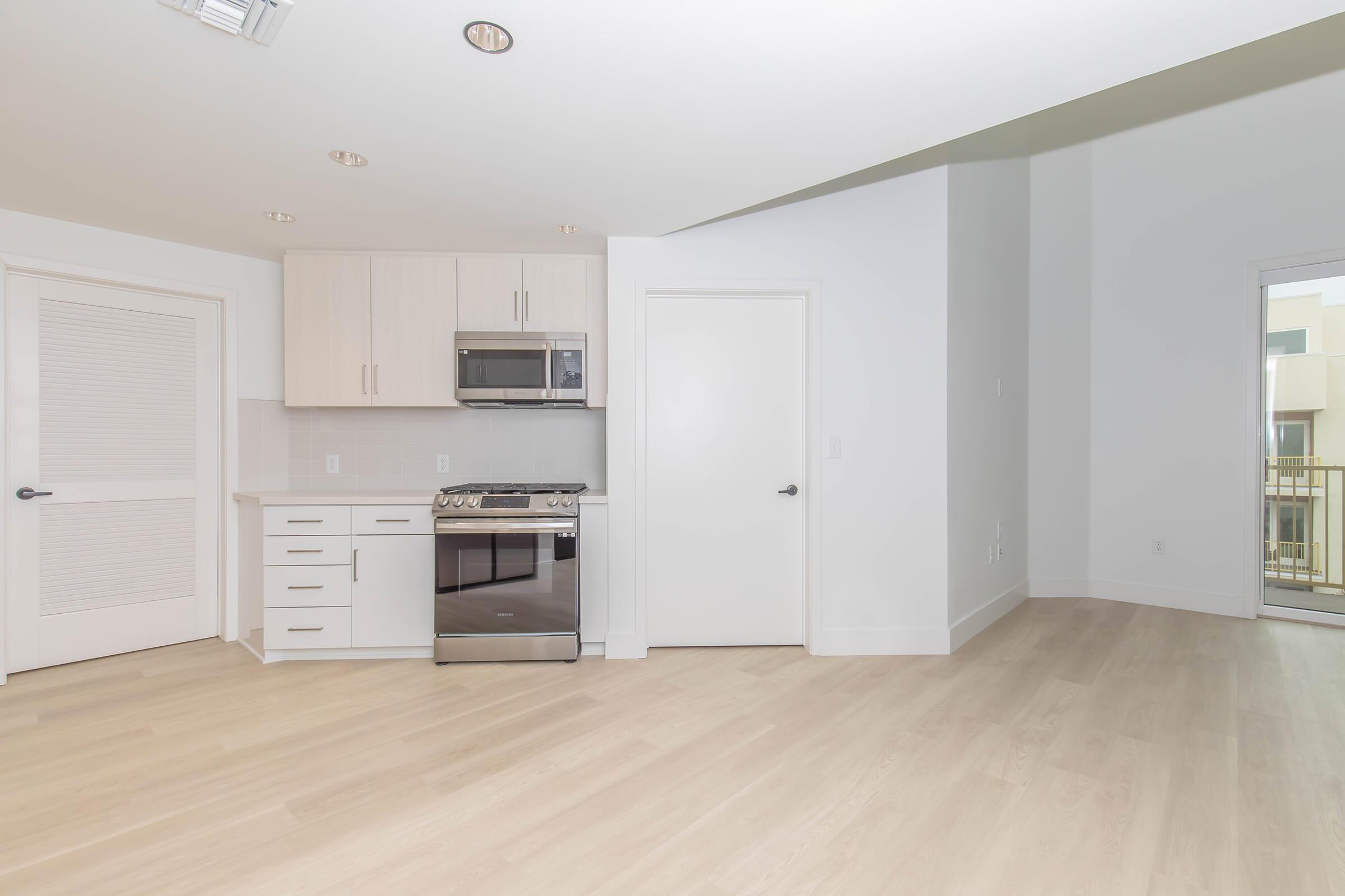 a kitchen with a wood floor