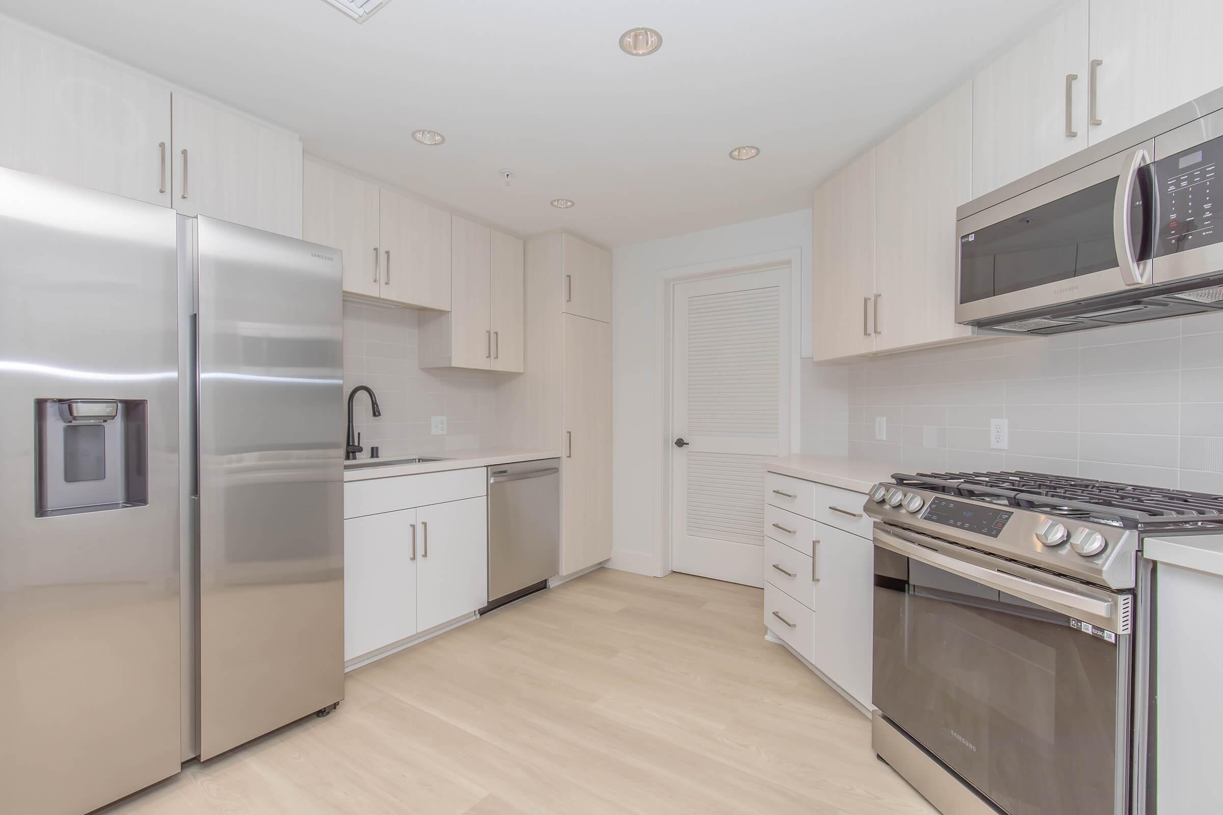 a stainless steel refrigerator in a kitchen