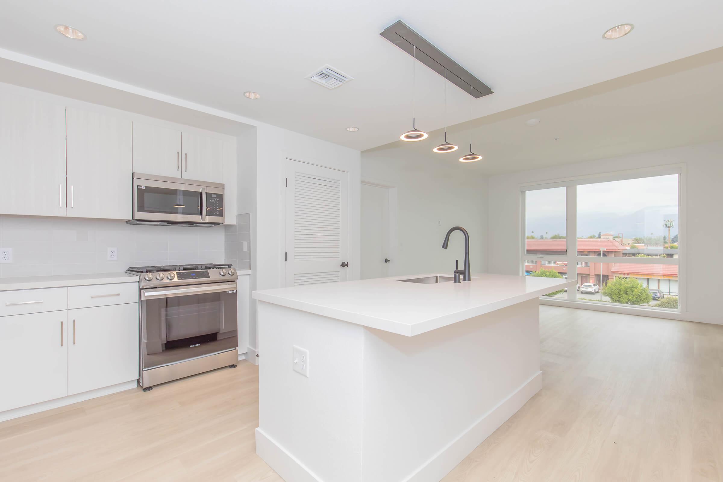 a kitchen with a wood floor