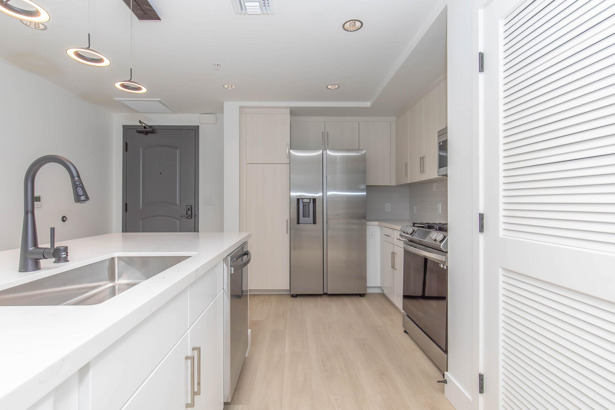 a kitchen with a sink and a window