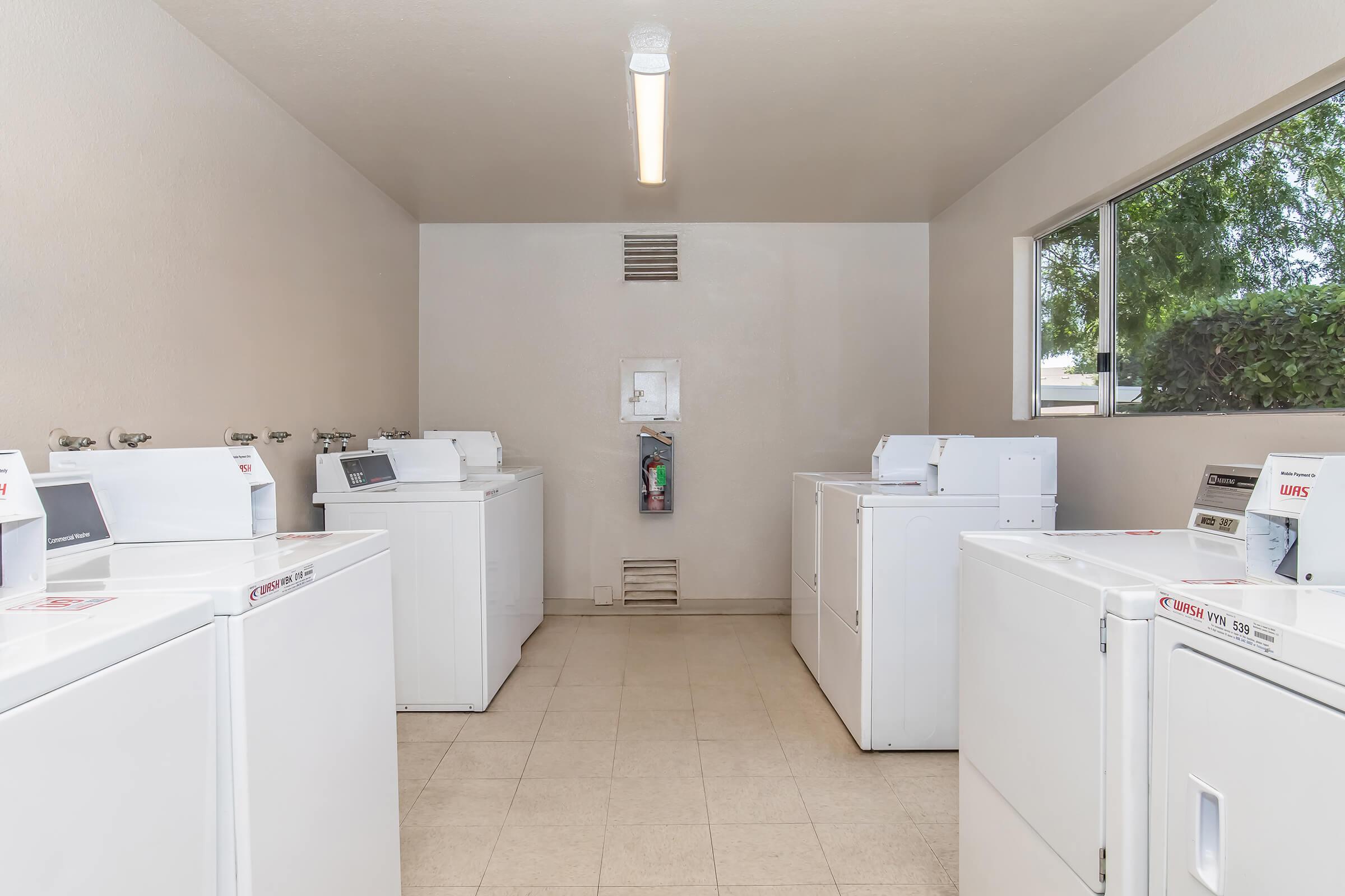 a kitchen with a sink and a refrigerator