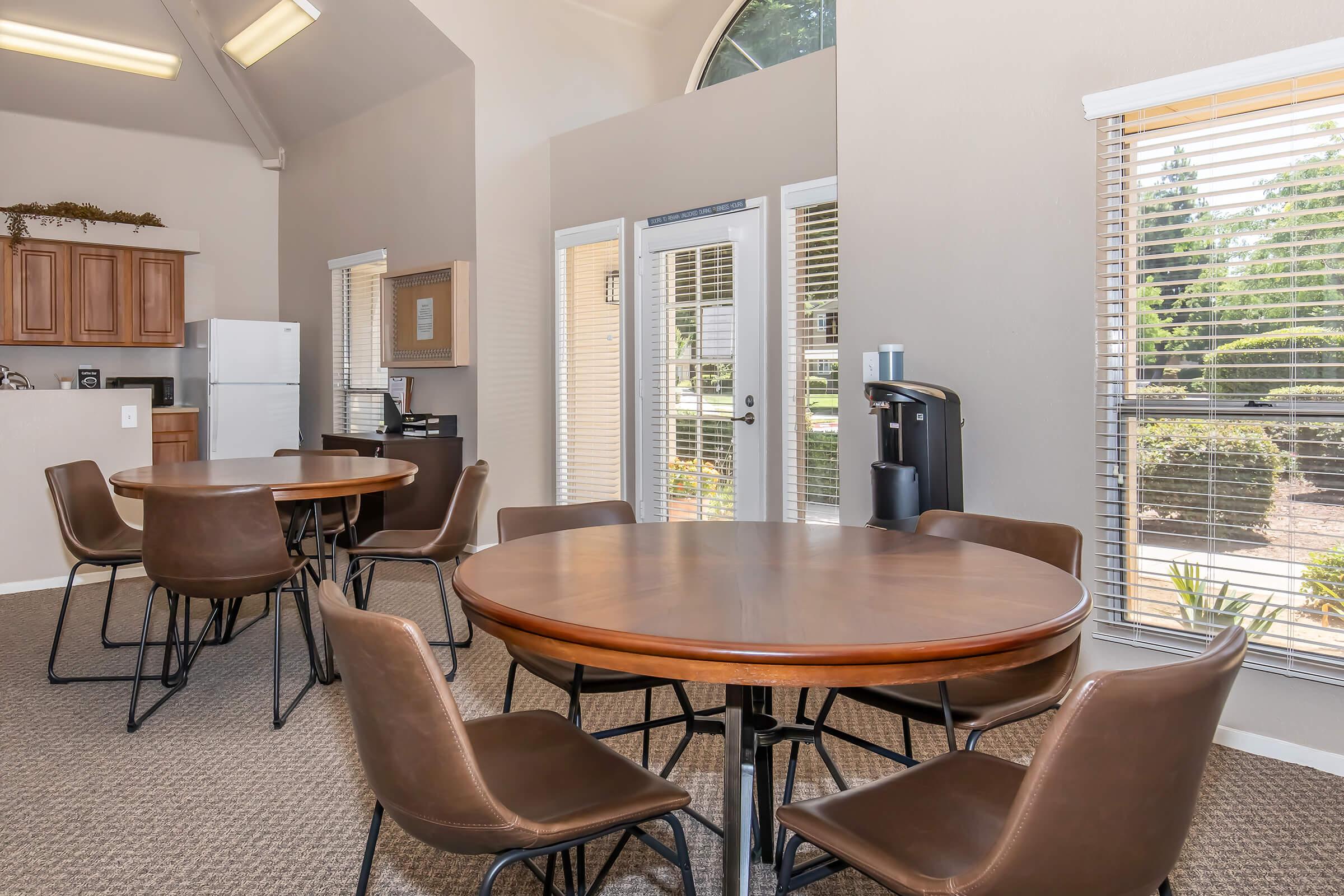 a room filled with furniture and a large window