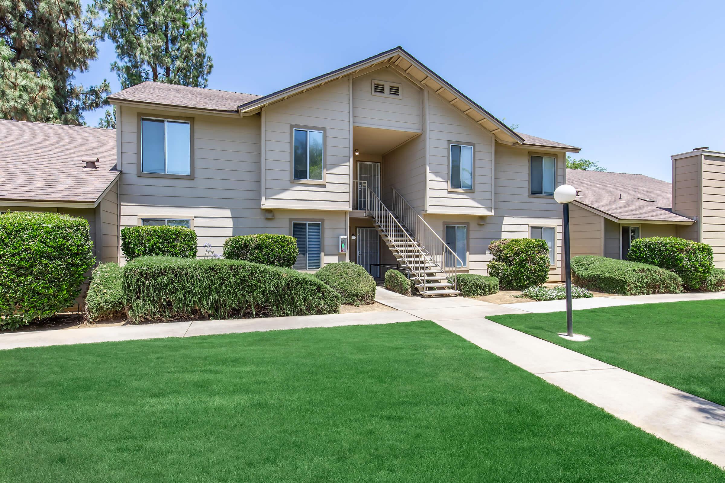 a large lawn in front of a house