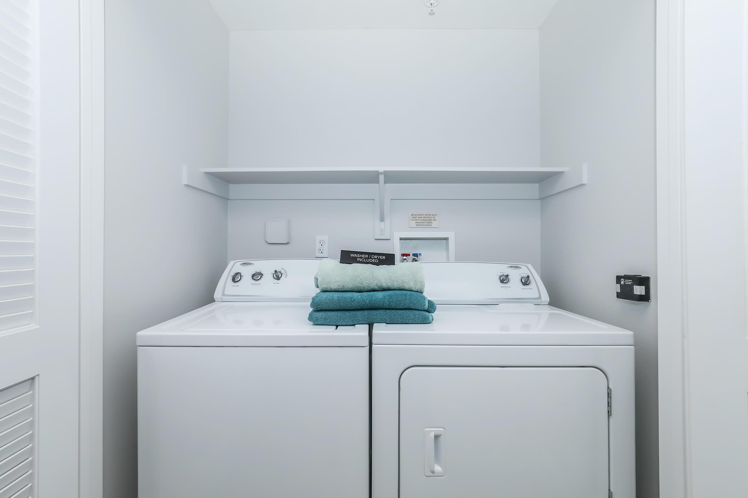 a refrigerator freezer sitting next to a sink