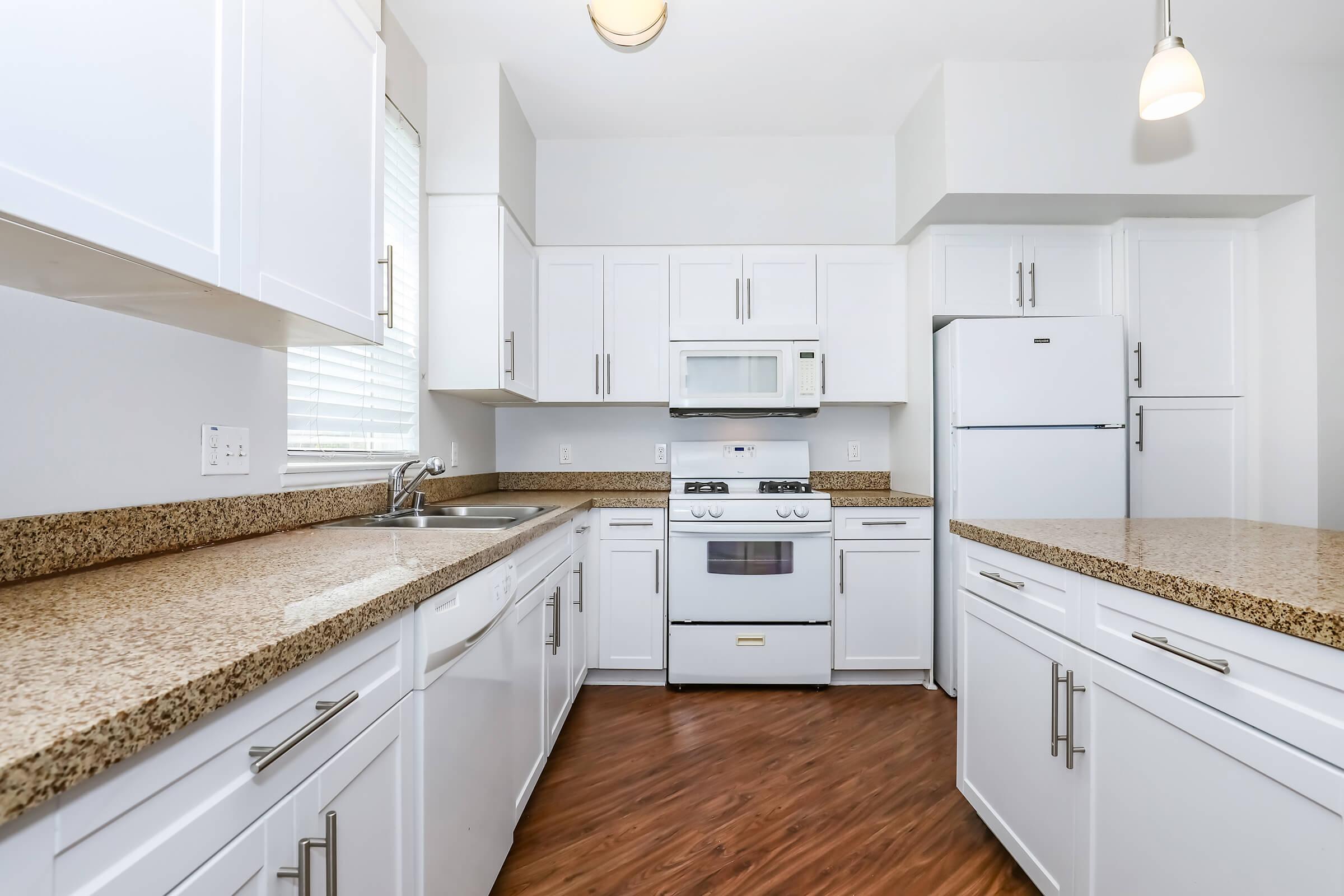 a kitchen with a stove top oven