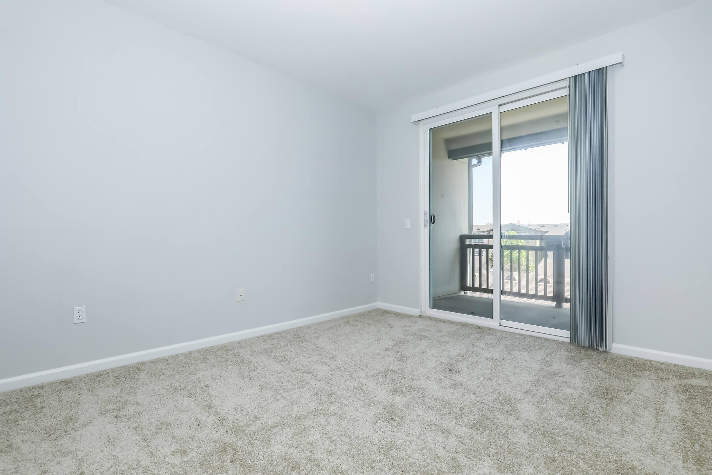 a bedroom with a large window