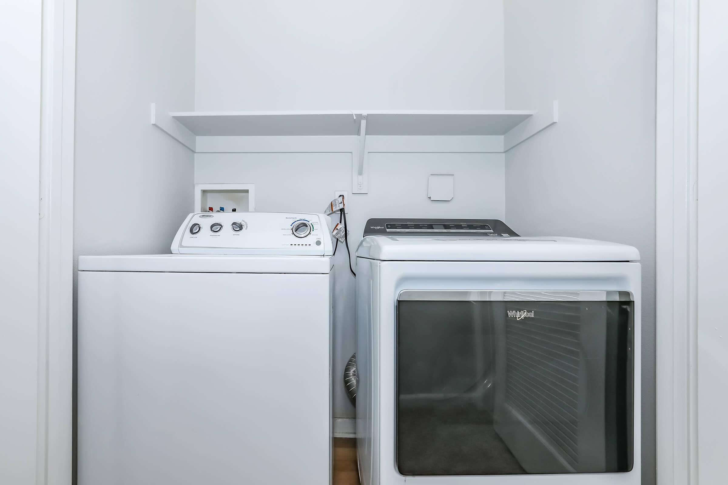 a microwave oven sitting on top of a refrigerator