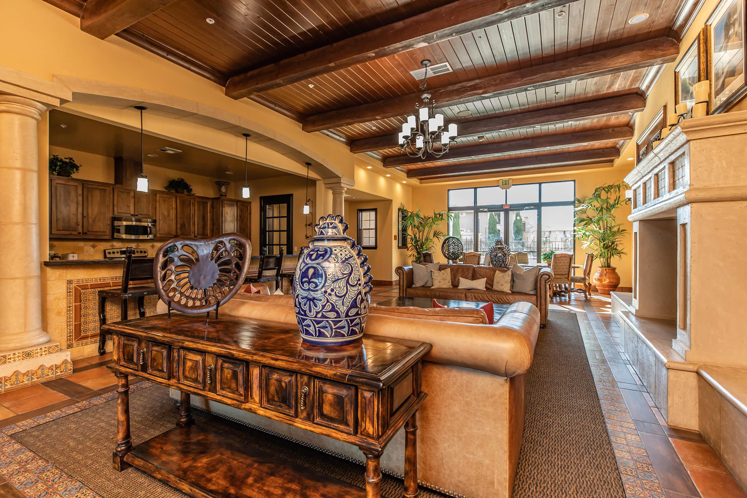 a room filled with furniture and a table in front of a building