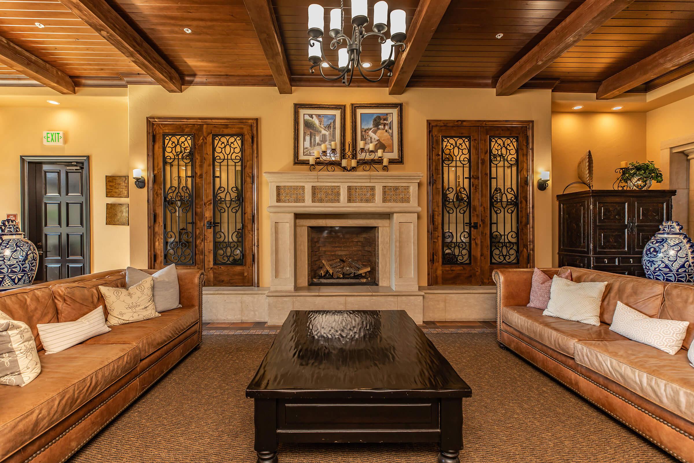 a living room filled with furniture and a fireplace