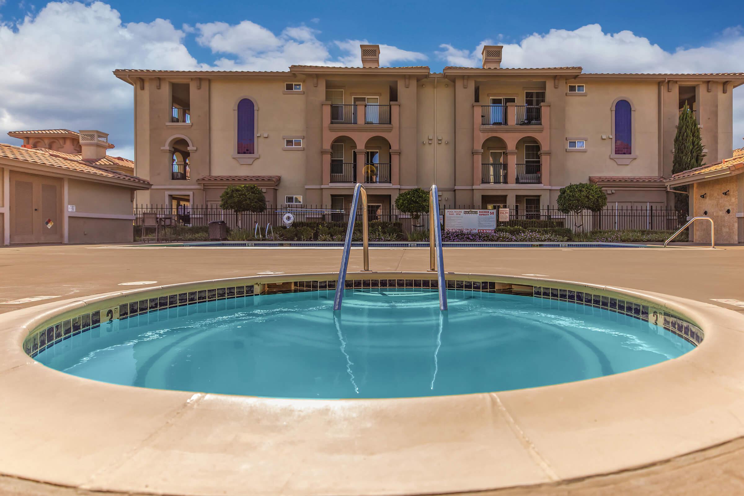 a large pool of water in front of a building