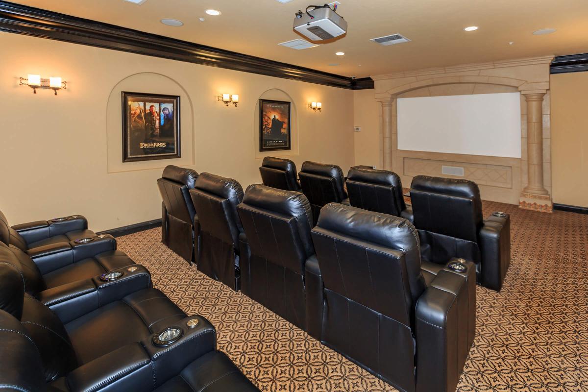 a living room filled with furniture and a flat screen tv