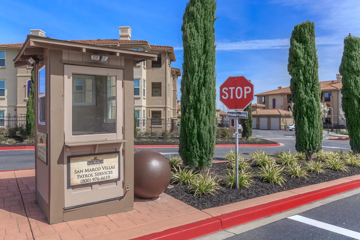 a red stop sign sitting on the side of a building