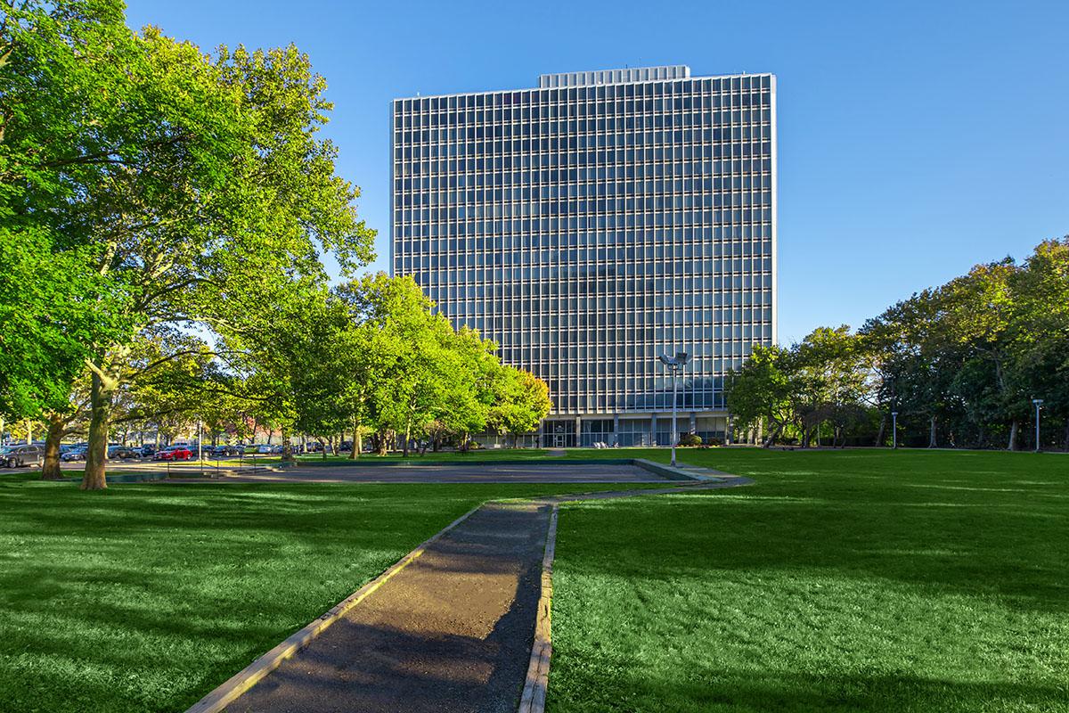 a building with a grassy field