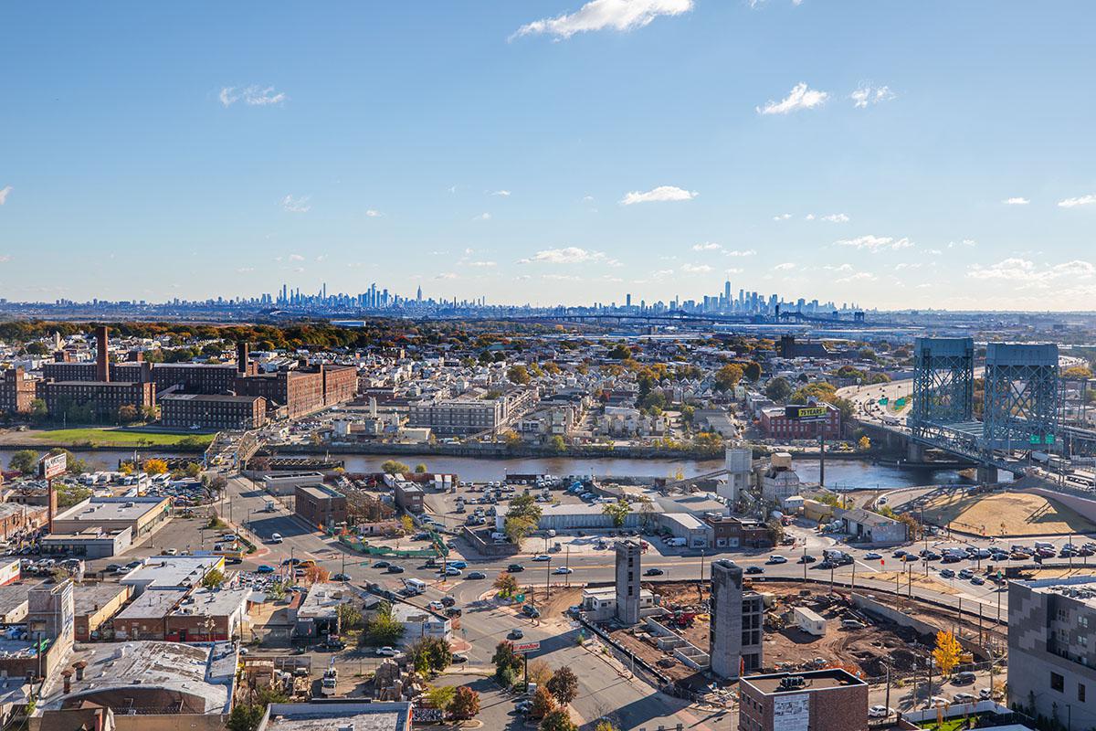 a large body of water with a city in the background