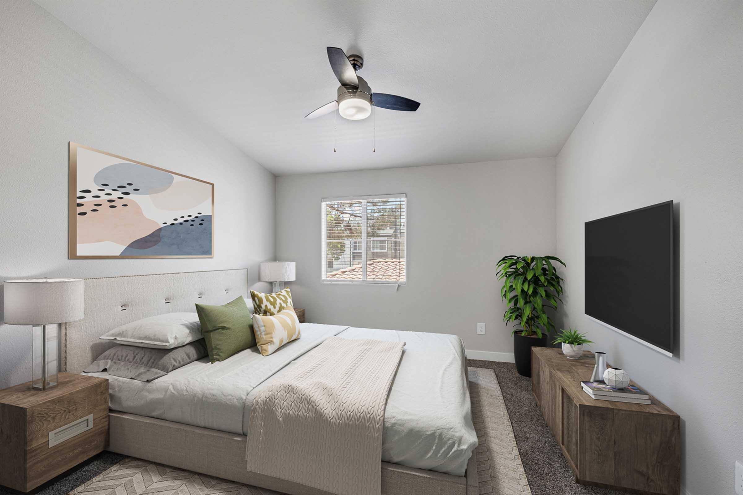 A cozy bedroom with light gray walls and a high ceiling. It features a bed with white and green bedding, two wooden nightstands, and modern lamps. A large window lets in natural light, and a potted plant adds a touch of greenery. A contemporary painting hangs above the bed, and a flat-screen TV is mounted on the opposite wall.