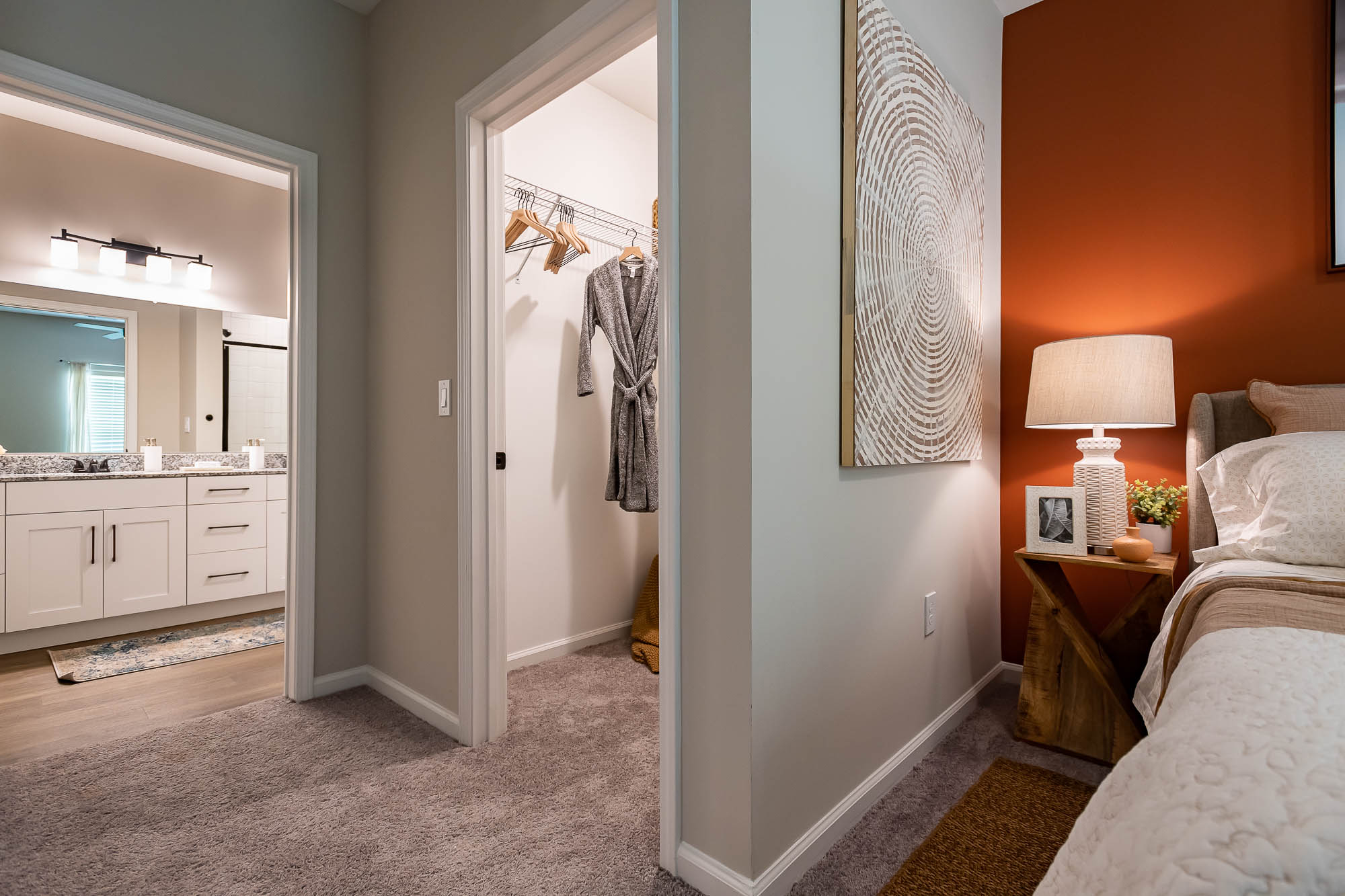 a bedroom with a large mirror