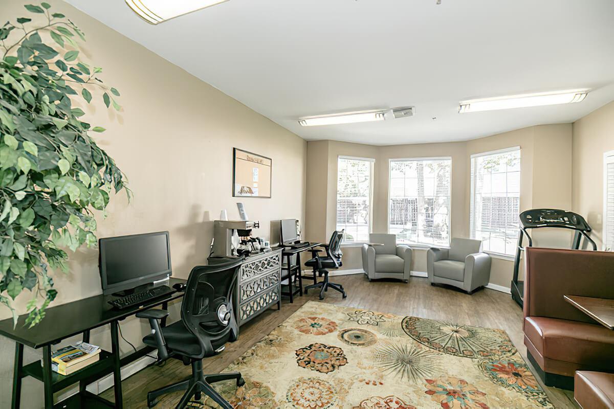 a living room filled with furniture and a large window