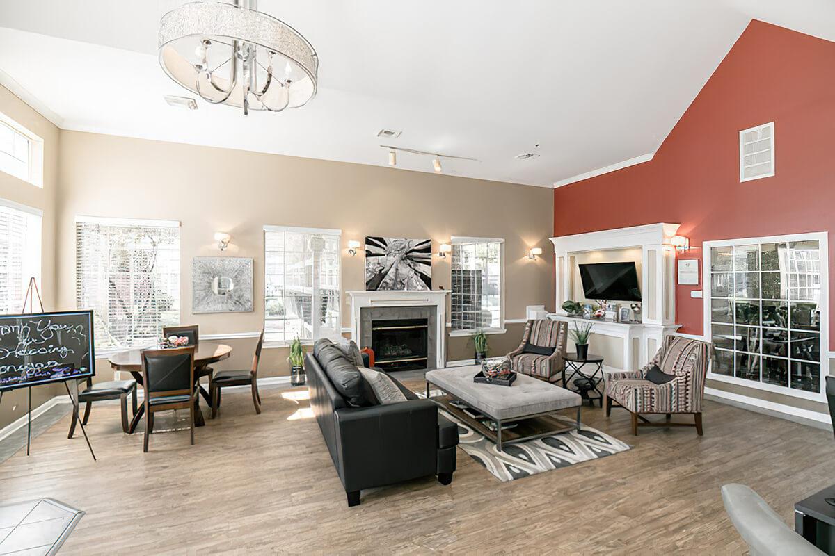 a living room filled with furniture and a fireplace