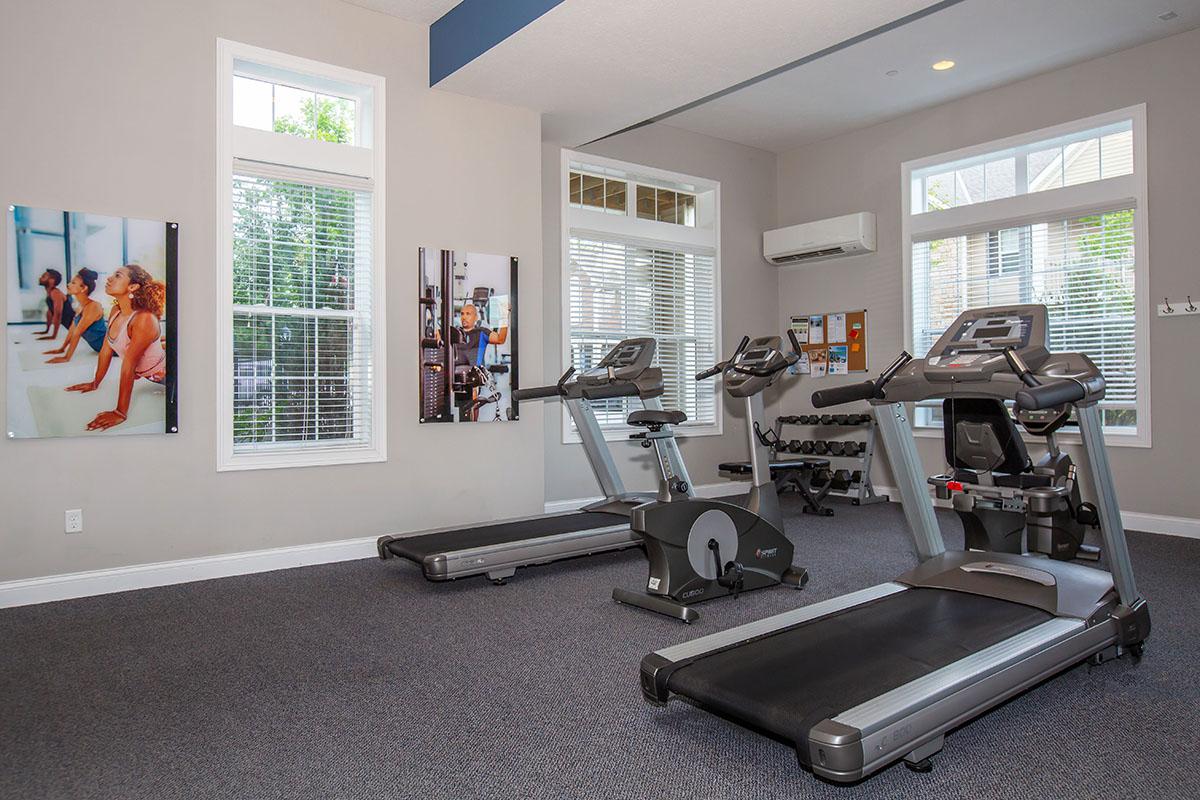 a room filled with furniture and a large window